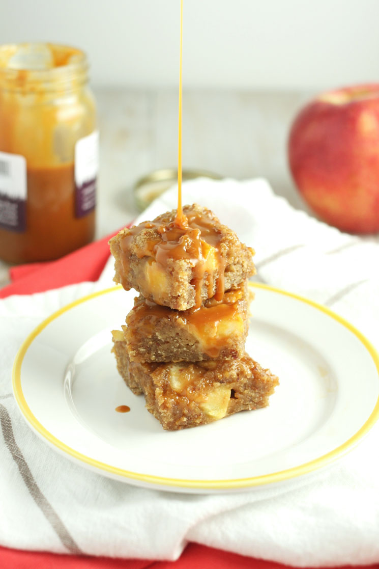 Caramel Apple Blondies (+ a VIDEO!) // 24 Carrot Life These fudgy Caramel Apple Blondies are the perfect holiday treat and you would never guess that they are made with healthy ingredients like whole wheat flour, almond meal, and coconut oil. I created a video to show you how easy it is to make these!